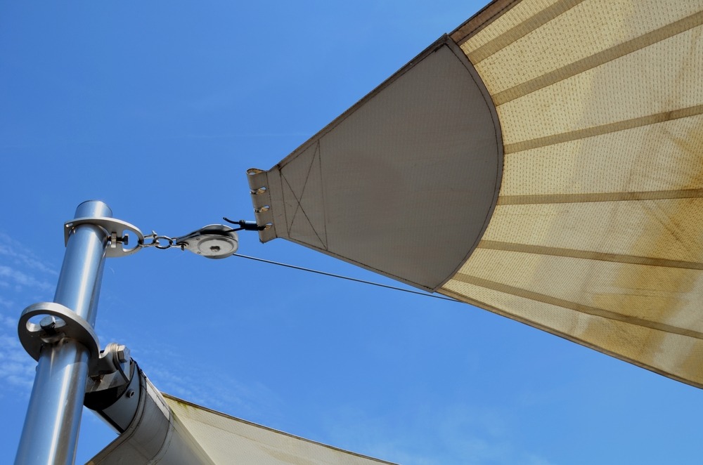 Parasol,,Awning,,Folding,Tarpaulin,Against,The,Sun,Is,Rolled,Up